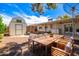 Outdoor dining set on gravel backyard with a covered patio, perfect for entertaining at 8310 E Glenrosa Ave, Scottsdale, AZ 85251