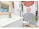Modern bathroom with trendy shower curtain, white vanity, and a mirrored cabinet at 8310 E Glenrosa Ave, Scottsdale, AZ 85251