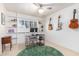 Bright bedroom with built in bookshelves, ceiling fan, and decorative guitars hanging on the wall at 8310 E Glenrosa Ave, Scottsdale, AZ 85251