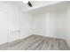 Bright bedroom featuring a sleek wooden laminate floor at 8310 E Glenrosa Ave, Scottsdale, AZ 85251