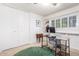 Bright bedroom featuring neutral walls, a ceiling fan, a closet, and a desk with chair at 8310 E Glenrosa Ave, Scottsdale, AZ 85251