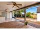 Inviting covered patio with ceiling fans, a wood deck, and views of the backyard at 8310 E Glenrosa Ave, Scottsdale, AZ 85251
