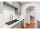 Beautiful kitchen featuring modern appliances, bright counter tops, and a stainless steel sink at 8310 E Glenrosa Ave, Scottsdale, AZ 85251