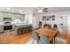 Bright, open kitchen with island, modern appliances, and adjacent dining area, complete with stylish decor at 8310 E Glenrosa Ave, Scottsdale, AZ 85251