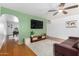 Bright living room features a ceiling fan, archways, and hardwood flooring at 8310 E Glenrosa Ave, Scottsdale, AZ 85251