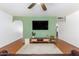 Bright living room features a ceiling fan, archways, and hardwood flooring at 8310 E Glenrosa Ave, Scottsdale, AZ 85251