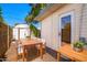 Outdoor dining area with a wooden table and chairs, along with a side table at 8310 E Glenrosa Ave, Scottsdale, AZ 85251