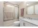 Bathroom featuring a vanity with a marble countertop and a shower-tub combination at 8730 E Dewan Ave, Mesa, AZ 85208
