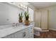 Bright bathroom featuring a marble countertop vanity, an enclosed shower, and a toilet at 8730 E Dewan Ave, Mesa, AZ 85208