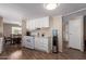 Kitchen with white cabinets and a spacious layout, ideal for cooking and entertaining at 8730 E Dewan Ave, Mesa, AZ 85208