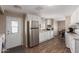Well-lit kitchen featuring stainless steel appliances and wood-look flooring at 8730 E Dewan Ave, Mesa, AZ 85208