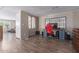 Spacious living room featuring a large desk, and a view into other rooms at 8730 E Dewan Ave, Mesa, AZ 85208