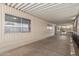 Covered patio with multiple windows bringing the outdoors in and views of the backyard at 8730 E Dewan Ave, Mesa, AZ 85208
