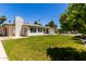 A lush backyard featuring an outdoor dining set and a glimpse of the sparkling pool at 9436 N 41St Dr, Phoenix, AZ 85051