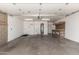 An open garage space with a workbench and laundry sink at 9436 N 41St Dr, Phoenix, AZ 85051