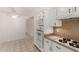 Bright kitchen with white cabinets, modern appliances, and ample counter space at 9436 N 41St Dr, Phoenix, AZ 85051