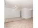 Open living room with tile flooring, a raised platform area, and neutral wall colors at 9436 N 41St Dr, Phoenix, AZ 85051