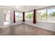 This bright sunroom features tile floors, large windows with views, and access to the backyard at 9436 N 41St Dr, Phoenix, AZ 85051