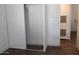 A bedroom closet features shelving and a sliding door, maximizing storage space in a home at 9501 E Broadway Rd # 254, Mesa, AZ 85208