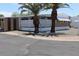 Cozy home featuring mature palm trees and a charming lattice-enclosed porch area at 9501 E Broadway Rd # 254, Mesa, AZ 85208