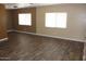 Spacious living room with lots of windows and stylish wood-look flooring at 9501 E Broadway Rd # 254, Mesa, AZ 85208
