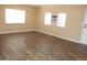 Comfortable living space featuring laminate flooring, great natural light, and an AC unit at 9501 E Broadway Rd # 254, Mesa, AZ 85208