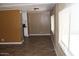 Bright living area featuring laminate flooring and views into the kitchen at 9501 E Broadway Rd # 254, Mesa, AZ 85208