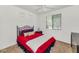 Inviting bedroom with a wrought iron bed, bright window, and neutral carpet, creating a comfortable retreat at 955 E Knox Rd # 137, Chandler, AZ 85225