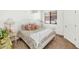 Comfortable bedroom featuring floral accents, a bright window, and chandelier, creating a charming atmosphere at 955 E Knox Rd # 137, Chandler, AZ 85225