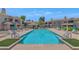 Resort-style community pool featuring lounge chairs and umbrellas, perfect for relaxation and summer fun at 955 E Knox Rd # 137, Chandler, AZ 85225