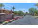 Elegant entrance to the Savona community with stone signage and vibrant landscaping at 955 E Knox Rd # 137, Chandler, AZ 85225