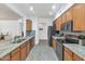 Updated kitchen with stainless steel appliances, breakfast bar, and stylish backsplash tiles at 955 E Knox Rd # 137, Chandler, AZ 85225