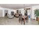 Spacious living area showcasing a comfortable sofa, dining table, and access to the outdoors at 955 E Knox Rd # 137, Chandler, AZ 85225