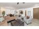 Open-concept living room with ample seating, a dining area, and a view of the kitchen, ideal for entertaining at 955 E Knox Rd # 137, Chandler, AZ 85225