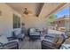 Inviting covered patio area with comfortable seating and ceiling fan, perfect for outdoor relaxation and entertaining at 955 E Knox Rd # 137, Chandler, AZ 85225