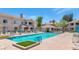 Stunning pool area with lounge chairs and lush landscaping, creating a relaxing outdoor oasis at the community at 955 E Knox Rd # 137, Chandler, AZ 85225