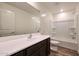 Bathroom featuring a vanity, mirror, and a shower and tub combo at 1050 W West Virginia Ave, Florence, AZ 85132