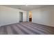 Spacious bedroom with neutral carpet and access to ensuite bathroom; an ideal space to relax and unwind at 1050 W West Virginia Ave, Florence, AZ 85132