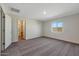 Bright and airy bedroom with new carpet, neutral paint, and a walk-in closet at 1050 W West Virginia Ave, Florence, AZ 85132