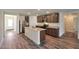 Modern kitchen featuring granite countertops, stainless steel appliances, and an island at 1050 W West Virginia Ave, Florence, AZ 85132
