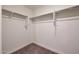 Well-organized walk-in closet featuring ample hanging space, offering storage solutions for an organized lifestyle at 1050 W West Virginia Ave, Florence, AZ 85132