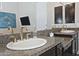 Bathroom with dual sinks, granite countertops, gold fixtures and dark cabinetry at 10841 N Mountain Vista Mtn, Fountain Hills, AZ 85268