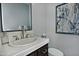 Well-lit half bathroom features a vanity sink with a modern faucet at 10841 N Mountain Vista Mtn, Fountain Hills, AZ 85268