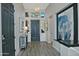 The foyer is decorated with eye catching art and an elegant console table with decorative lighting at 10841 N Mountain Vista Mtn, Fountain Hills, AZ 85268