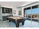 Entertainment area featuring a pool table, wet bar, and a sliding glass door leading to an outdoor patio at 10841 N Mountain Vista Mtn, Fountain Hills, AZ 85268
