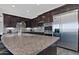 This kitchen offers stainless steel appliances, granite countertops, and dark wood cabinets for a touch of elegance at 10841 N Mountain Vista Mtn, Fountain Hills, AZ 85268