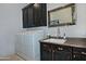 Functional laundry room features dark cabinetry, granite countertops, and a modern washer and dryer at 10841 N Mountain Vista Mtn, Fountain Hills, AZ 85268
