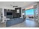 Bright living room features a fireplace, ceiling fan, and sliding glass doors to a balcony with a gorgeous mountain view at 10841 N Mountain Vista Mtn, Fountain Hills, AZ 85268