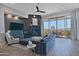 This living room offers a modern fireplace, ceiling fan, balcony access, and a mountain view for ultimate relaxation at 10841 N Mountain Vista Mtn, Fountain Hills, AZ 85268