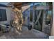 Cozy outdoor seating area with comfortable chairs, a brick patio, and decorative wall accents at 10841 N Mountain Vista Mtn, Fountain Hills, AZ 85268